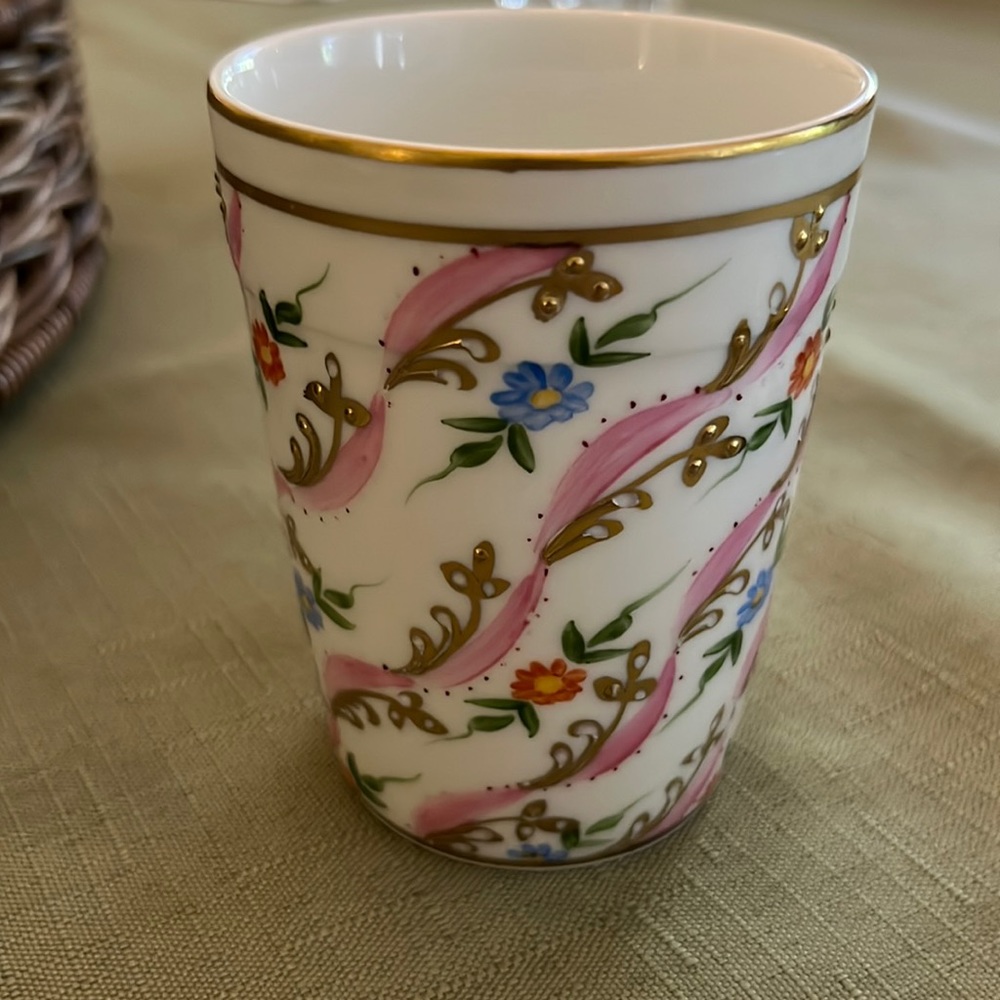 Porcelain painted cup. Embellished with textured gold. Made in France